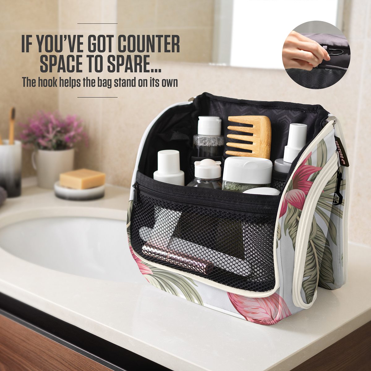 Flamingo-print toiletry bag standing upright on a bathroom counter, held open by its hook
